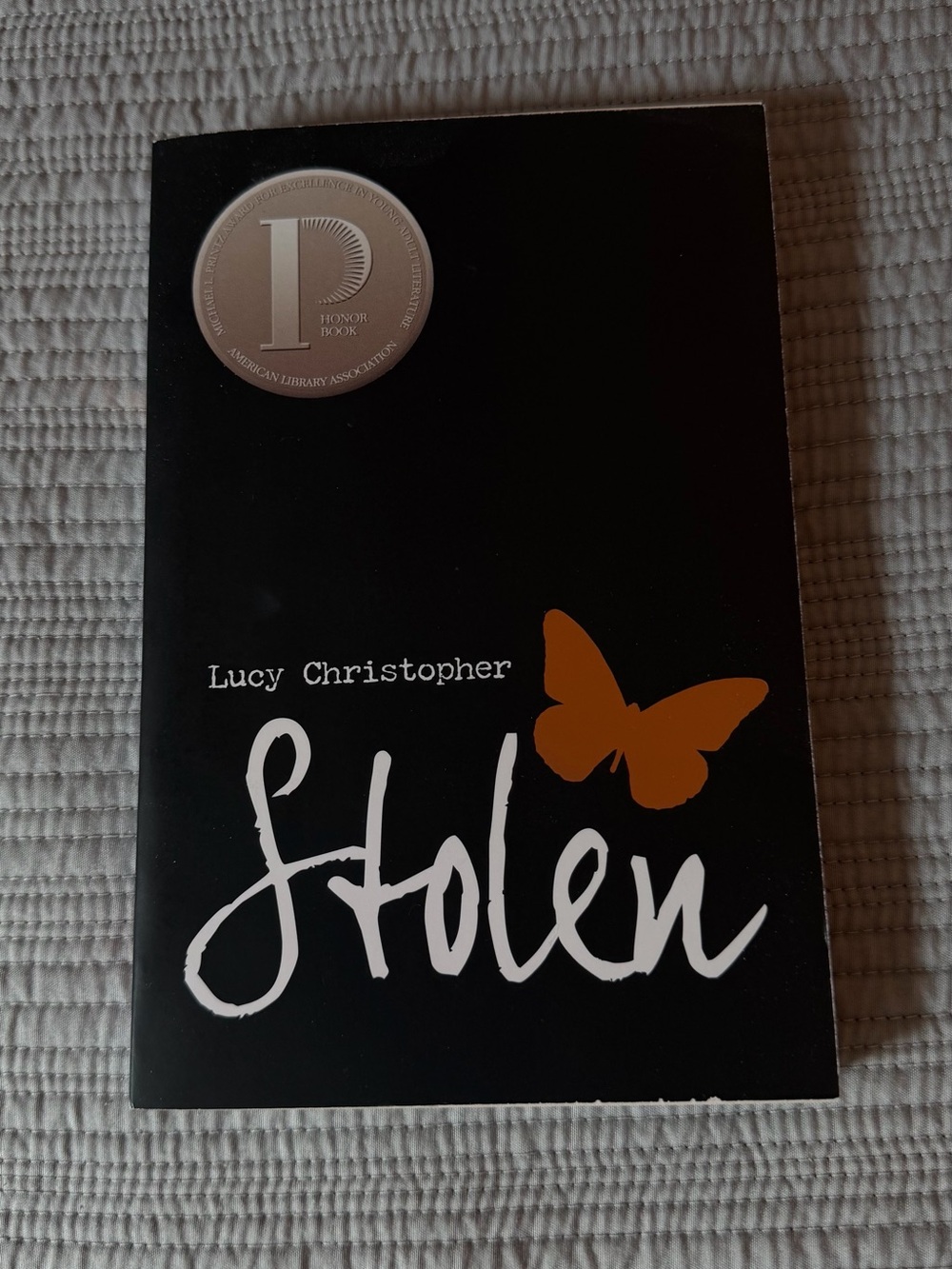 Stolen by Lucy Christopher - Black Cover with Orange Butterfly